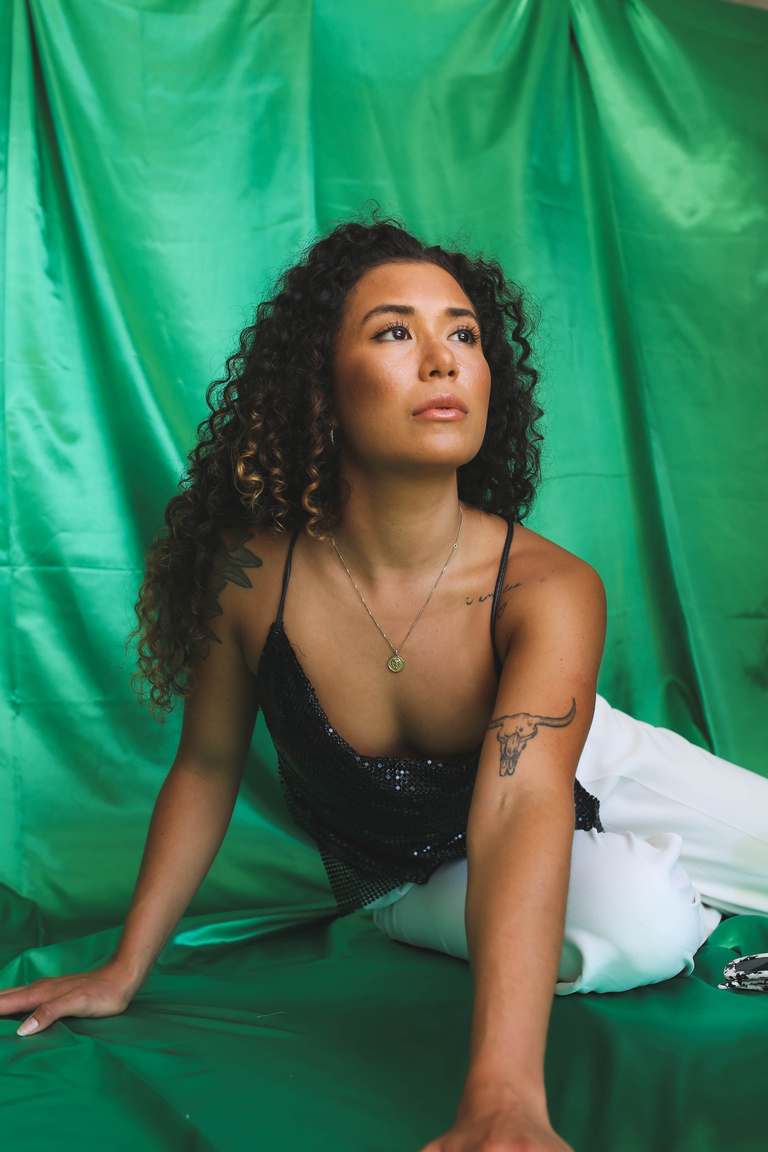 Woman Posing on Green Fabric